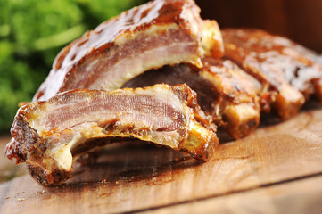 close up of a sliced grilled barbecue ribs on a cutting board