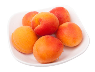 apricots on plate isolated