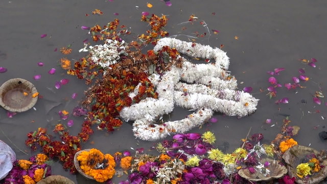 ceremony flowers garlands in sacred Ganges river, India