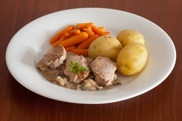 pork meat with potatoes and carrot