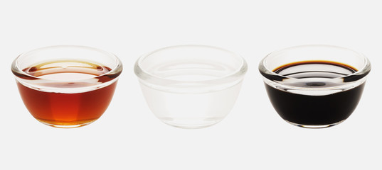 close up of bowls of red white and black vinegar