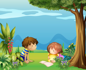 A boy with a girl reading in the garden