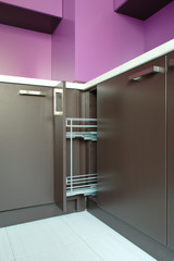 Newly fitted modern kitchen in purple and brown