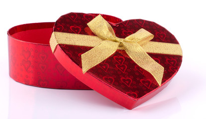 Heart shaped red gift box on white mirror background