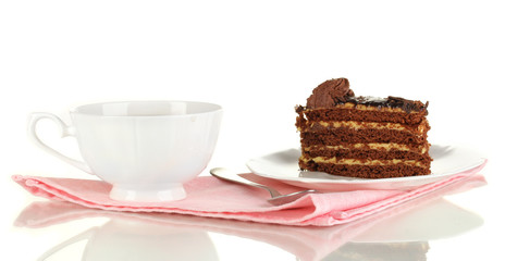 A cup of tea and delicious cake isolated on white