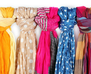 Many bright female scarfs close-up - obrazy, fototapety, plakaty