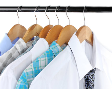 Shirts with ties on wooden hanger isolated on white