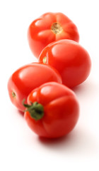 Fresh tomatoes on white