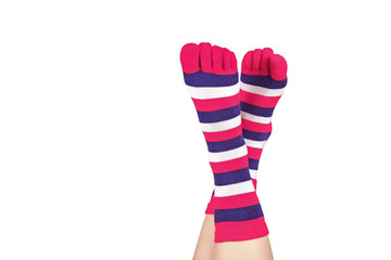 Ladies feet in socks with separated toes, isolated on white