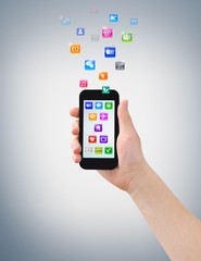 Right hand holding black smartphone with color icons moving up