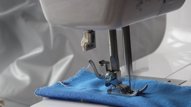Close up on a sewing machine showing complete process