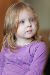 Picture of pensive small girl with blue eyes and blond hair
