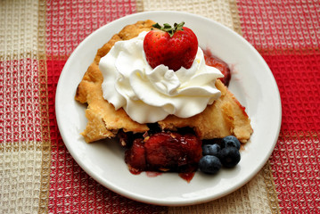 Fresh Fruit Pie on a White Plate