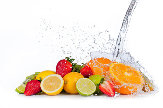 Fototapeta Fresh fruit with water splash, isolated on white background