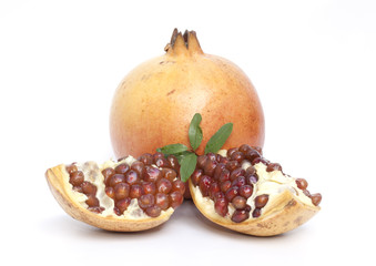 Pomegranate fruit and juice isolated on the white background