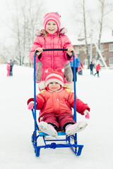 Happy children in winter outdoors