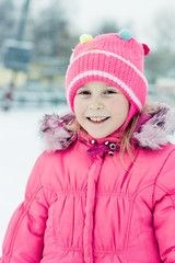 Beautiful happy girl in the red jacket.