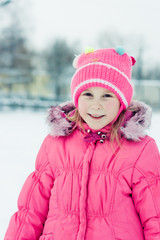 Beautiful happy girl in the red jacket.