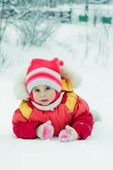 Beautiful baby in a red jacket