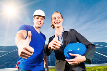 Green Energy - Solar panels with blue sky