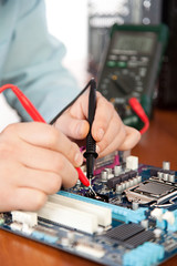 Fototapeta na wymiar Technician repairing computer hardware in the lab
