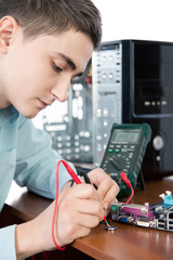 Technician repairing computer hardware in the lab