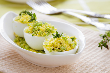 Boiled eggs stuffed with avocado