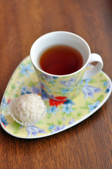 Small cup of tea and a raffaello