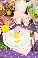 Serving Easter table with tasty dishes close-up