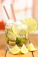 Fototapeta premium Glass of cocktail with lime and mint