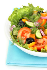 Fresh salad in plate isolated on white