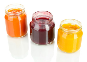 Baby puree in jars isolated on white