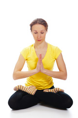 Young woman doing yoga exercise