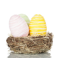Three Easter eggs in a nest