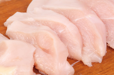 chicken meat sliced   on  cutting  board