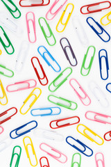 colorful paper clips in white background