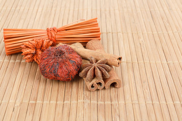 Star Anise and cinnamon on wooden background