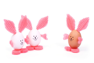 Three toy Easter rabbit made ​​of egg shell isolated on white