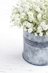 Bouquet of baby's breath flowers, on wooden background