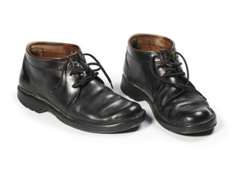 old  used comfortable walking shoes isolated on white