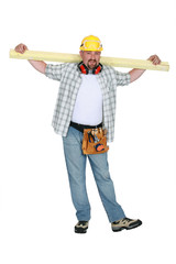 Naklejka premium A carpenter holding a plank.