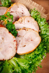 Smoked chicken roulade with salad  close-up