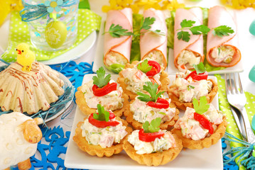 salty mini tartlets stuffed with vegetable and ham salad