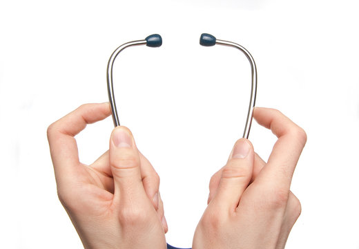 Hands holding a stethoscope isolated on white