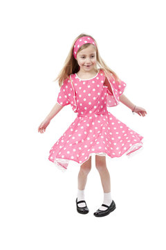 dancing little girl in pink dress