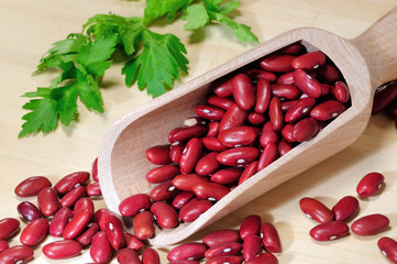 Red beans in a wooden spoon