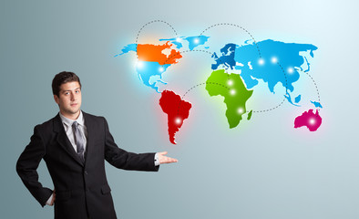 young man presenting colorful world map