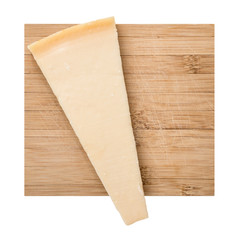 Parmesan cheese wedge on board