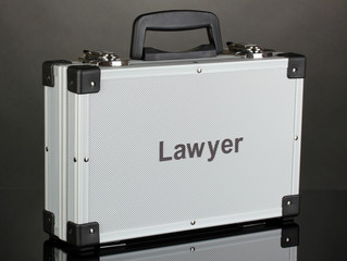 Silvery diplomat (suitcase) on grey background