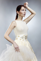 Fototapeta premium Beauty in fashion dress in natural colors